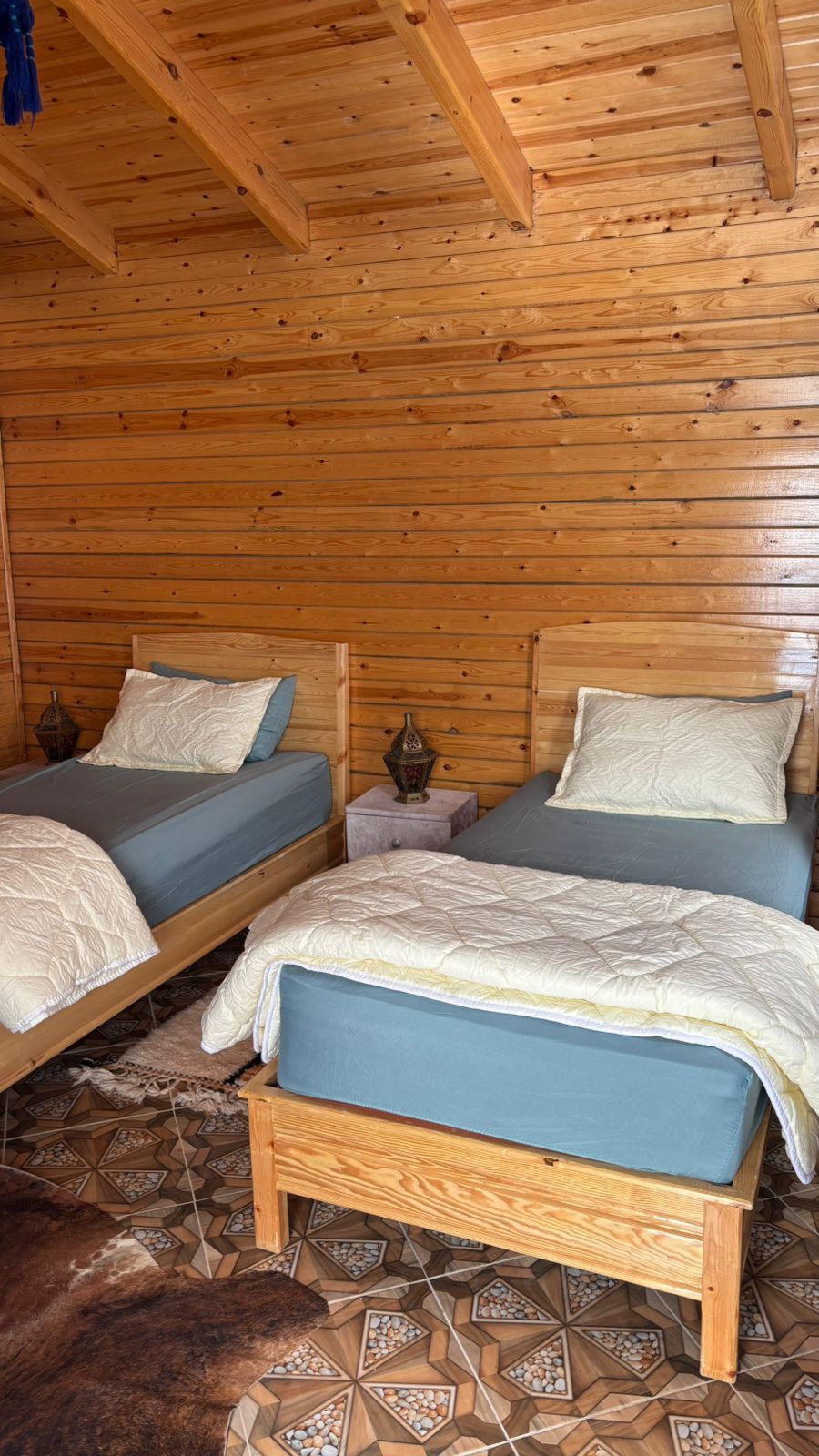 Twin beds with lantern